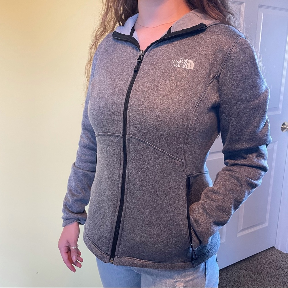 Women’s Grey North Face zip up hoodie.